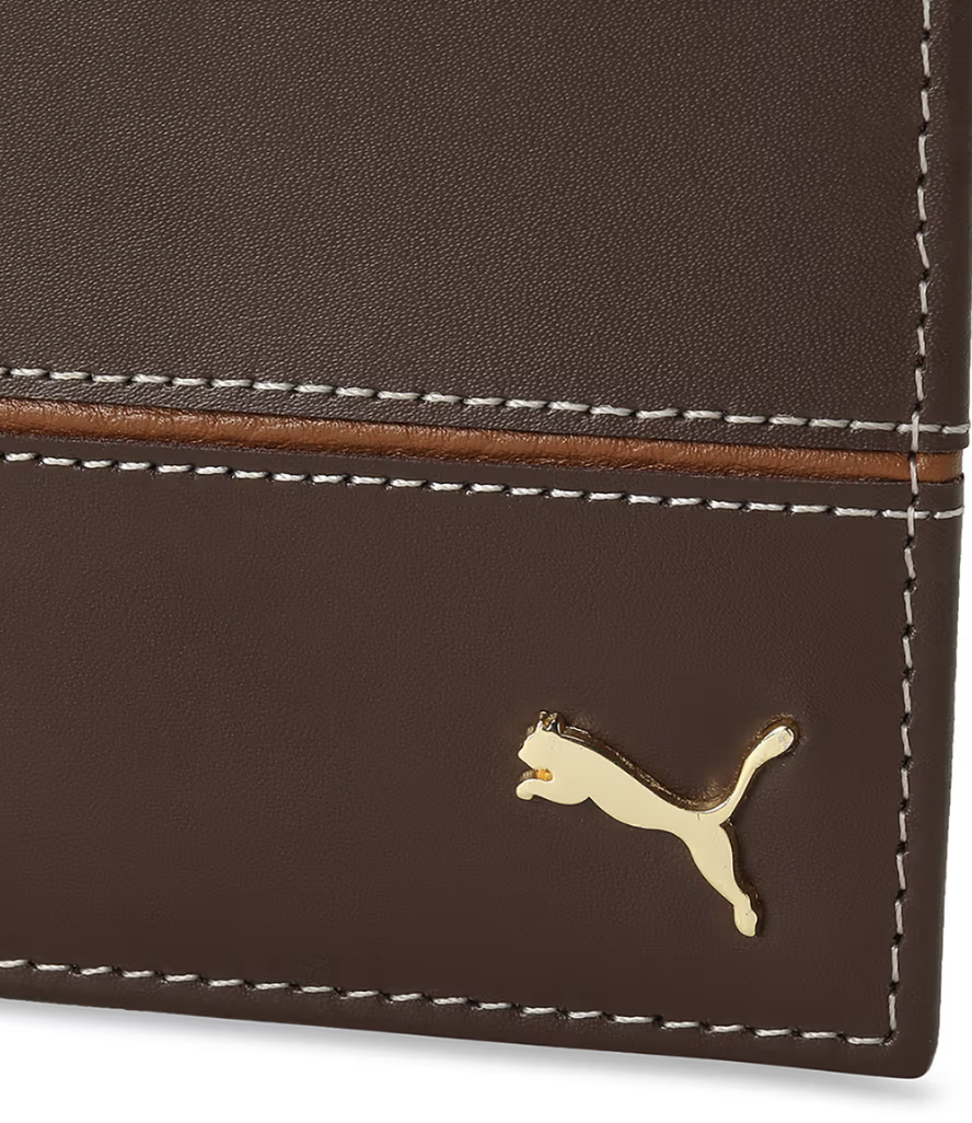 a brown and white puma leather wallet