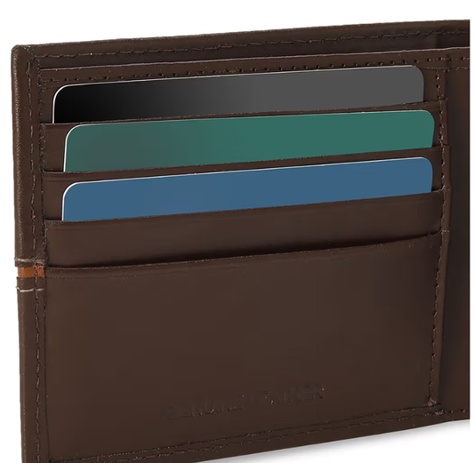 a brown leather wallet with four credit cards sticking out of it